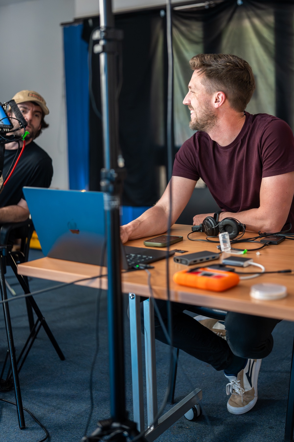 Lewis reviewing production material at a desk