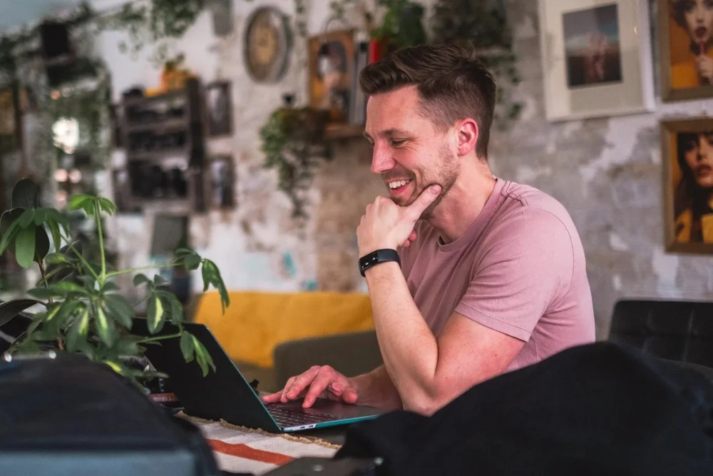 Lewis working on a laptop