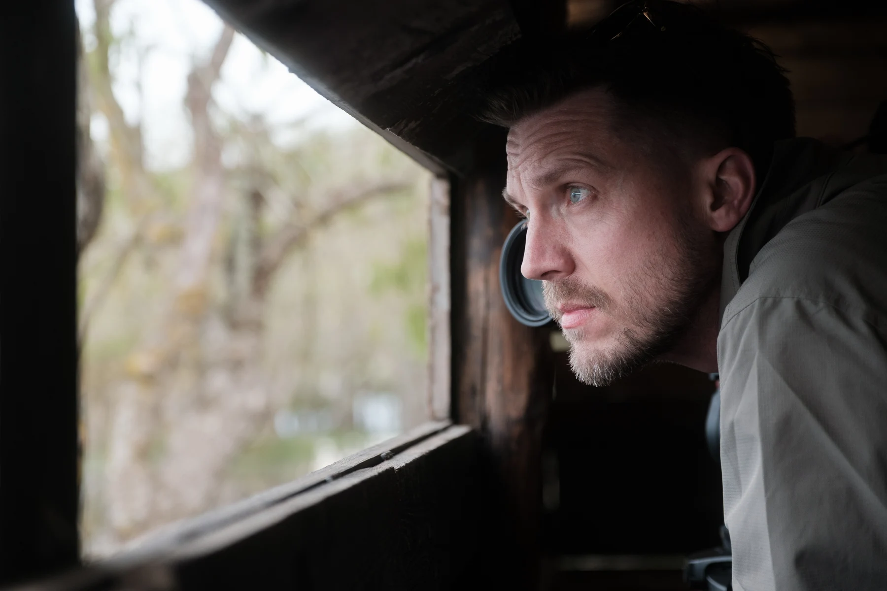 Lewis photographing wildlife from a hide