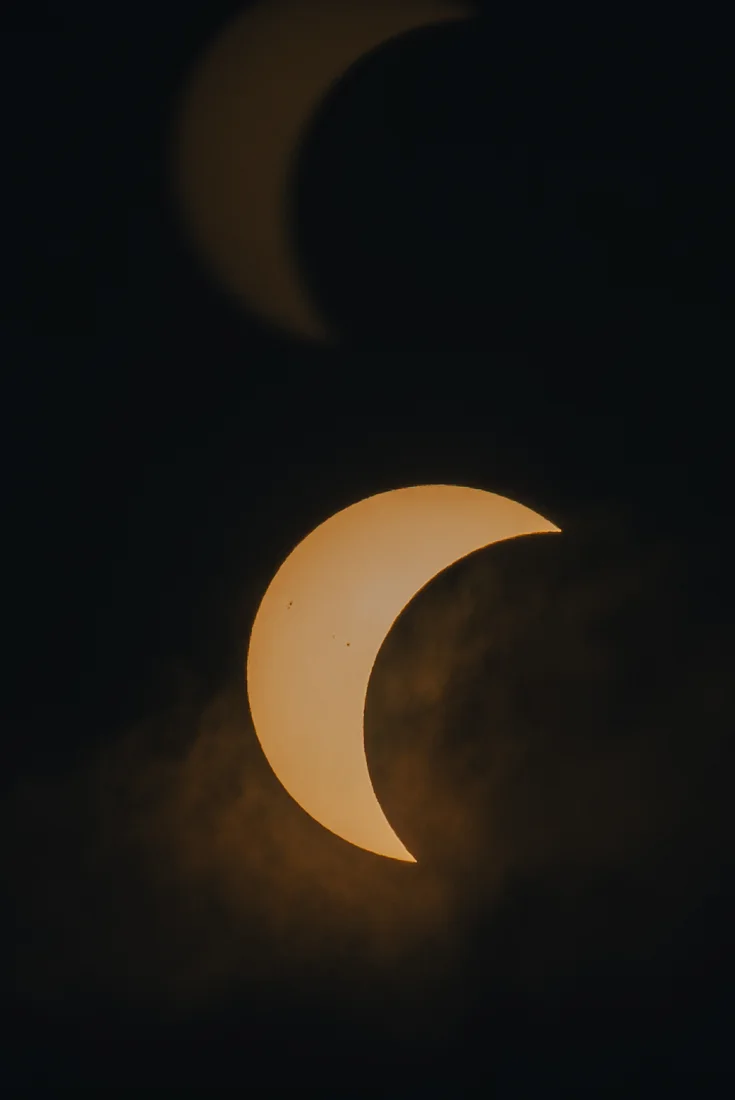 A partial solar eclipse in a dark sky