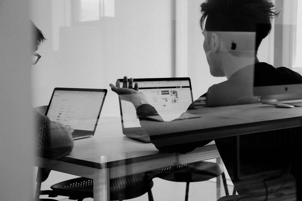 A planning conversation around laptops