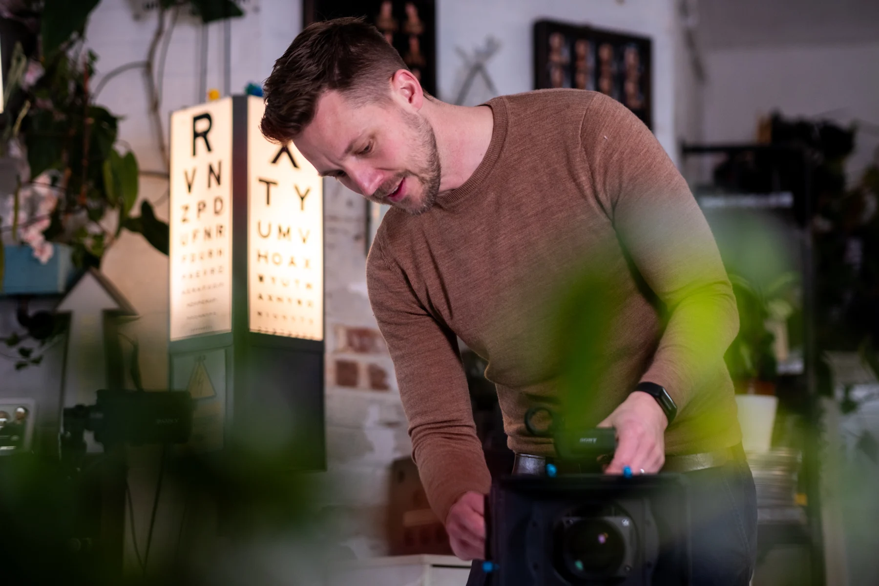 Lewis preparing a cinema camera for filming