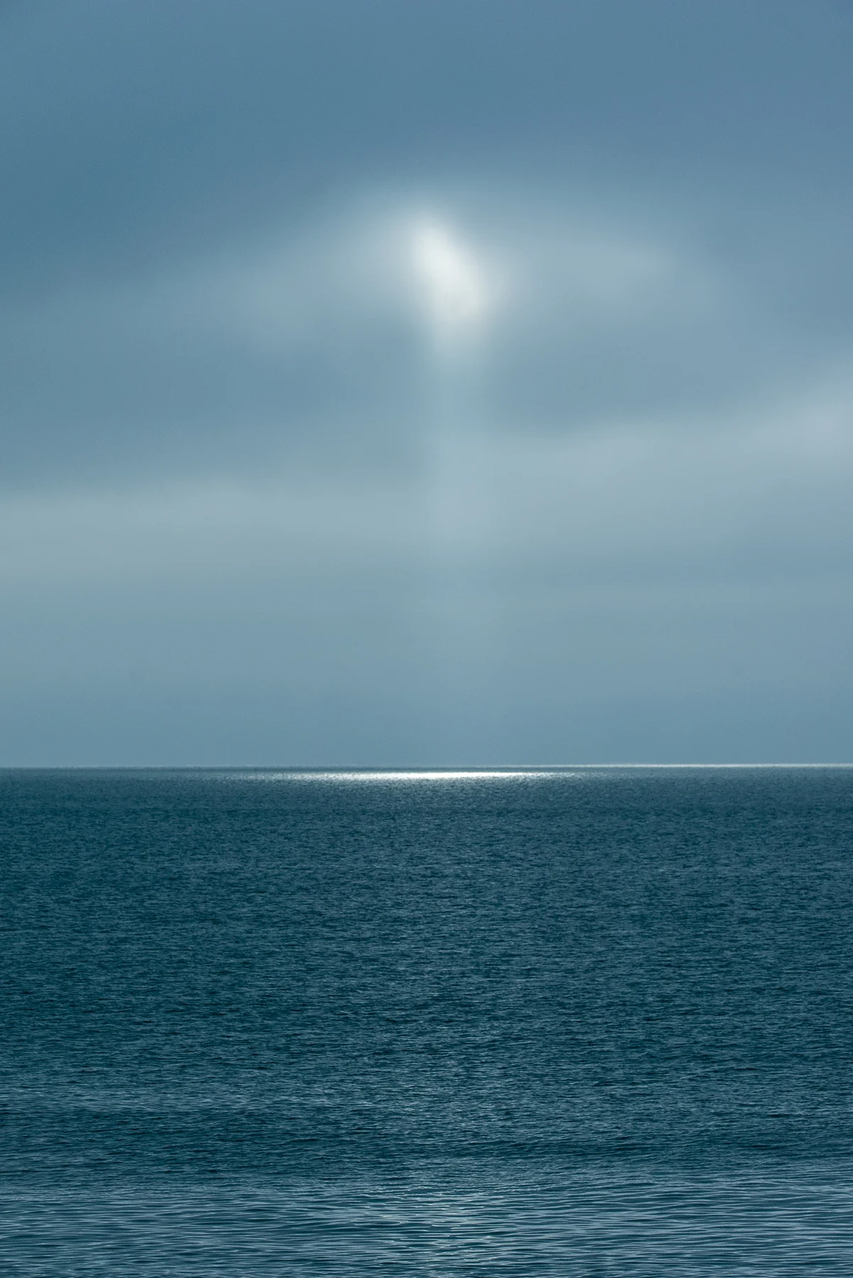 Sunlight over a calm blue sea